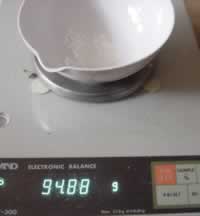 Place approximately 1 gram of powdered calcium carbonate int he crucible.
