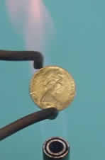 The bronzed coin.