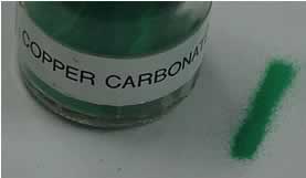 Solid copper carbonate is green in color and is insoluble in water.