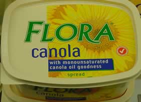 Margarines contain polyunsaturated  vegetable oils. The polyunsaturated fats are partially saturated to solidify them. 