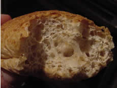The fluffy texture of bread is due to the formation of carbon dioxide during cooking.
