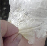 Roll the latex glove of the skin.