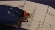 Place glue on the wing assembly as shown