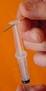 Preparing the syringe.