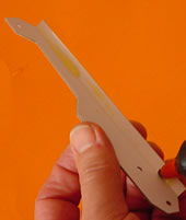 Fold the spin and glue it along the length of the lever.
