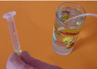 Fille the syringe with water.