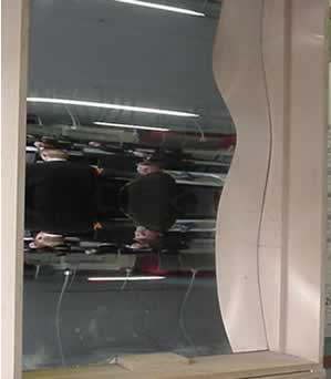 The curved mirror that formed the images above.